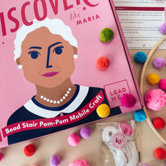 Pom-Pom Mobile Craft Kit: A Montessori-inspired kids craft kit designed for ages 8 and up, combining STEM learning with a fun DIY project. Includes materials to create a colorful mobile while developing fine motor skills, counting, and pattern recognition, along with a story about Maria Montessori and leadership conversation cards.